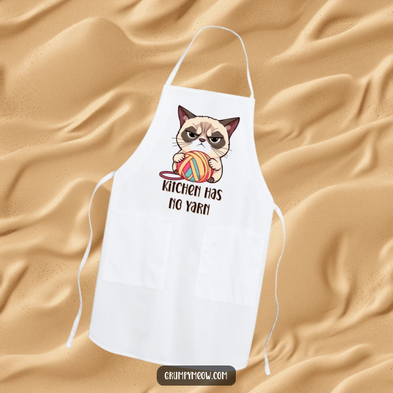 Funny grumpy cat wearing an apron, judging yarn with narrowed eyes, a great funny gift.