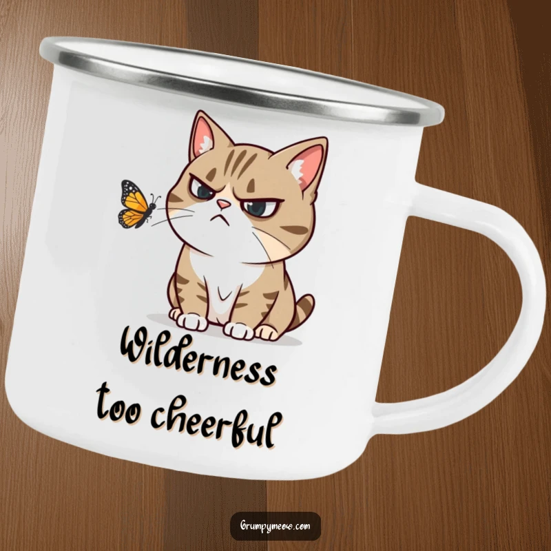 Funny camping mug with a grumpy cat ignoring a playful butterfly, conveying humorous annoyance and outdoor grit.