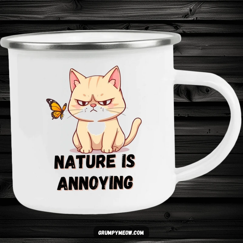 Funny camping mug: A grumpy cat with narrowed eyes watches a butterfly, perfect for outdoor enthusiasts who love a humorous, sarcastic touch.