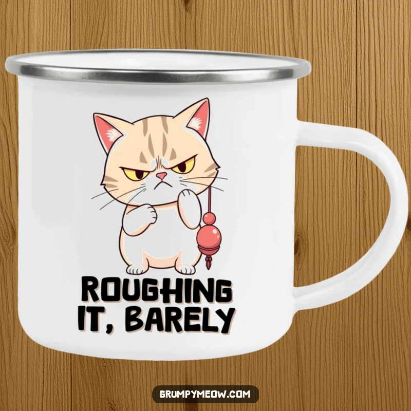 Funny grumpy cat with narrowed eyes disdainfully batting a dangling toy, designed for sassy outdoor sips.