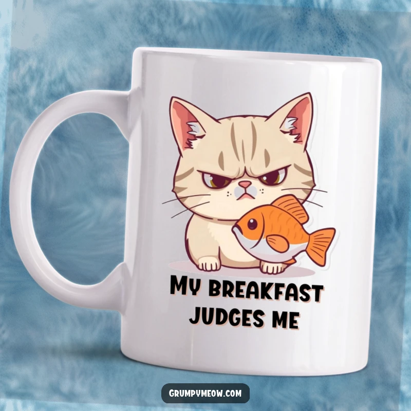 Funny grumpy cat mug with a frown, intensely staring at a fish, exuding hilarious feline judgment and hunger.