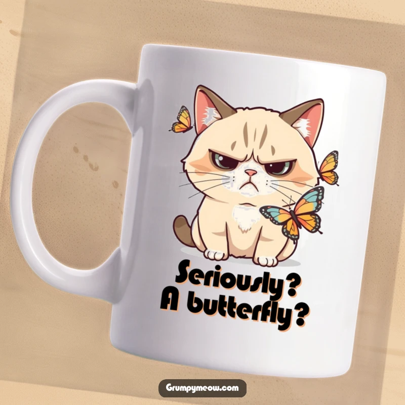 Funny grumpy cat mug, frowning skeptically at a delicate butterfly, a perfect gift for cat lovers who observe.