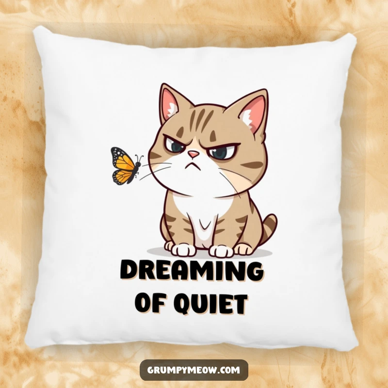 Funny pillow featuring a grumpy cat ignoring a playful butterfly, conveying humorous annoyance and cozy comfort.