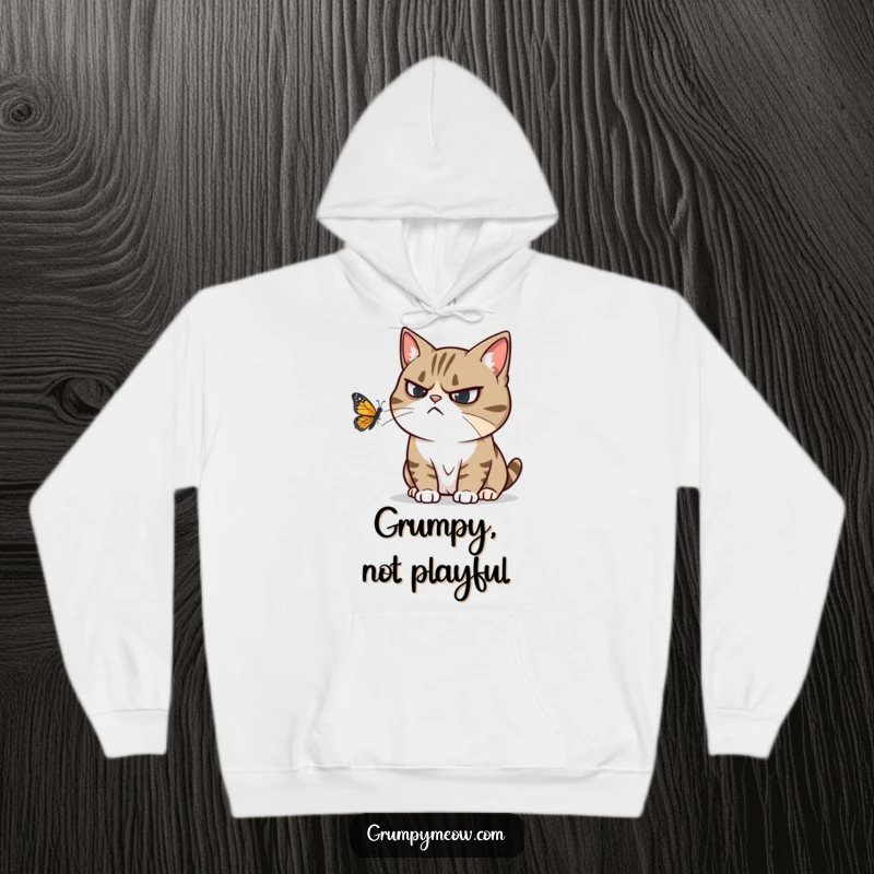 Funny hoodie featuring a grumpy cat ignoring a playful butterfly, conveying humorous annoyance and cozy comfort.