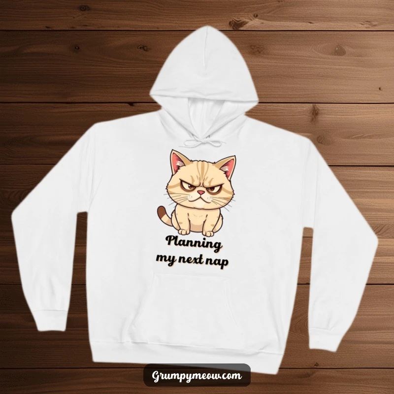 Funny hoodie of a grumpy cat with narrowed eyes, conveying intense focus and the subtle art of plotting mischief.