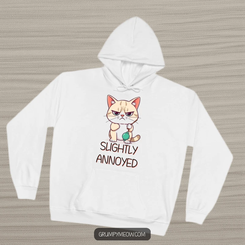 Funny Hoodie featuring a grumpy cat looking unimpressed, with a paw idly swatting a dangling toy, offering warmth and relatable humor.
