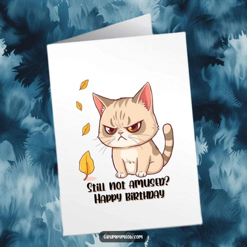 Funny Free Printable Birthday Card: A grumpy cat with narrowed, curious eyes watches a single falling leaf.
