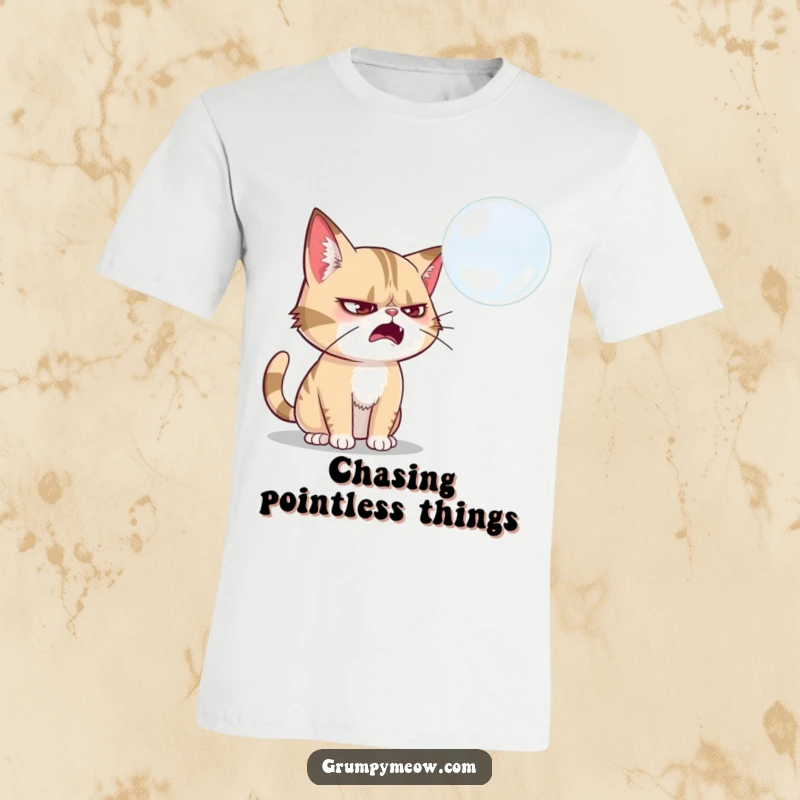 Funny grumpy cat t-shirt, attempting to swat a fragile soap bubble, symbolizing playful determination, great funny gift.