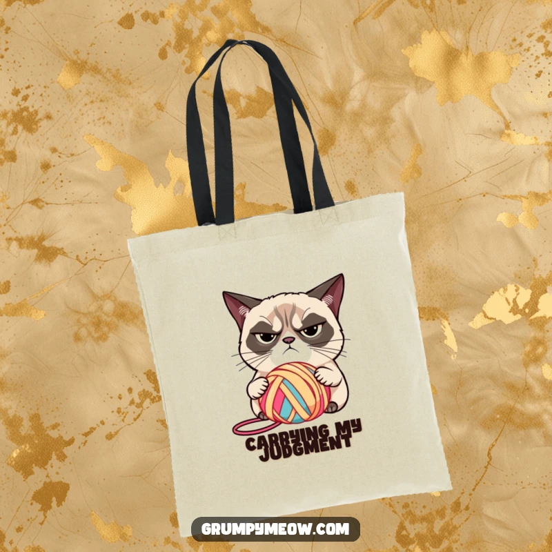 Funny grumpy cat with narrowed eyes, judging a brightly colored ball of yarn on a tote bag, a stylish funny gift.
